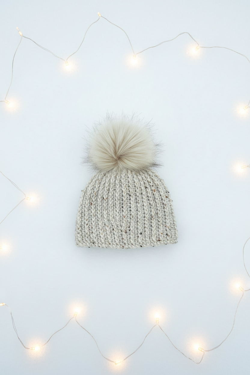 Fireside Oat classic rib crochet beanie styled flat lay with winter lighting