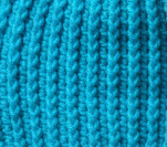 Close up of Glacier Pulse ribbed crochet beanie highlighting thick ribbed stitch for cold climate wear