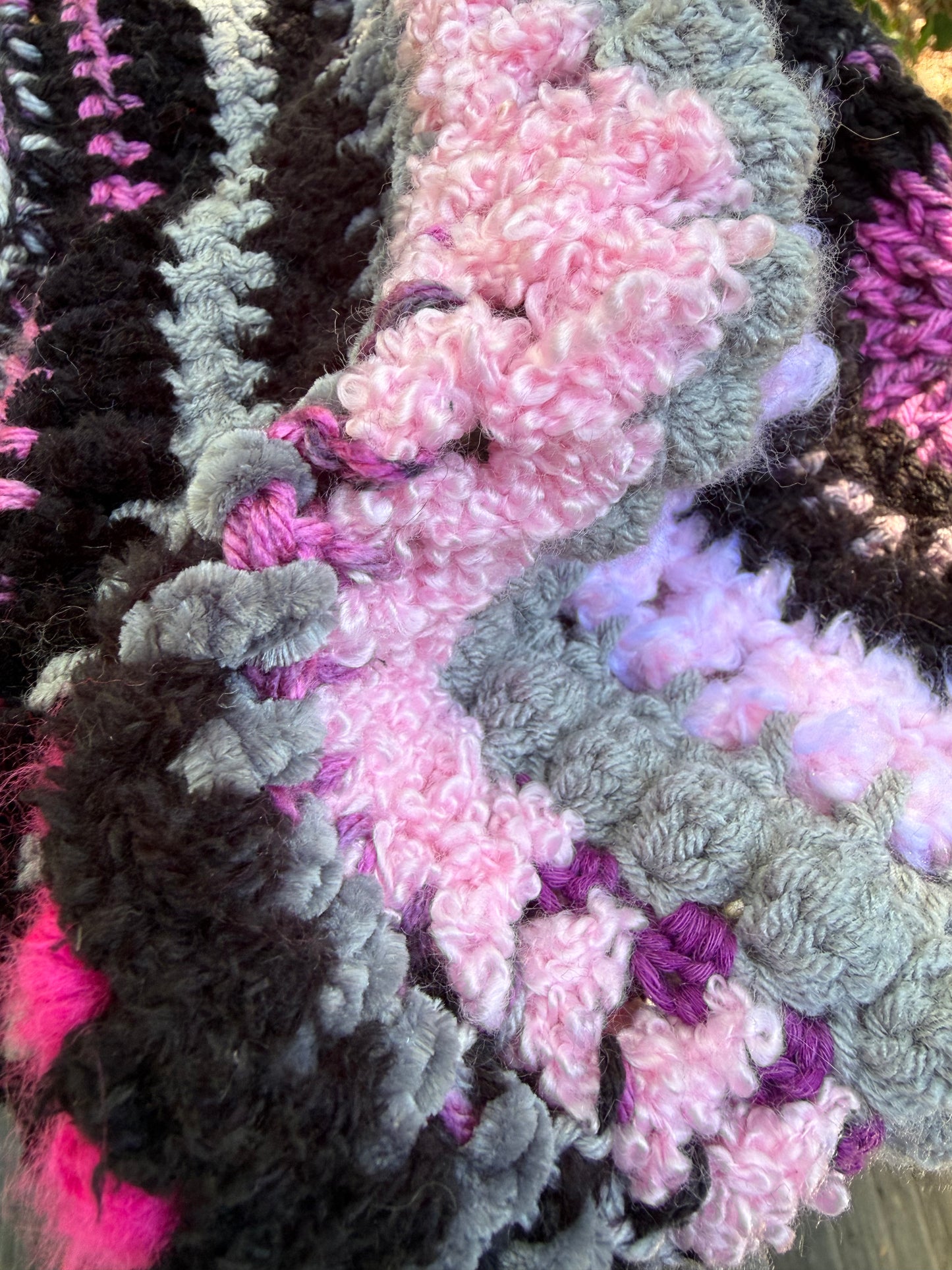 Dimensional pink, grey, lavender and black crochet stitch detail on Love Spell No. 01