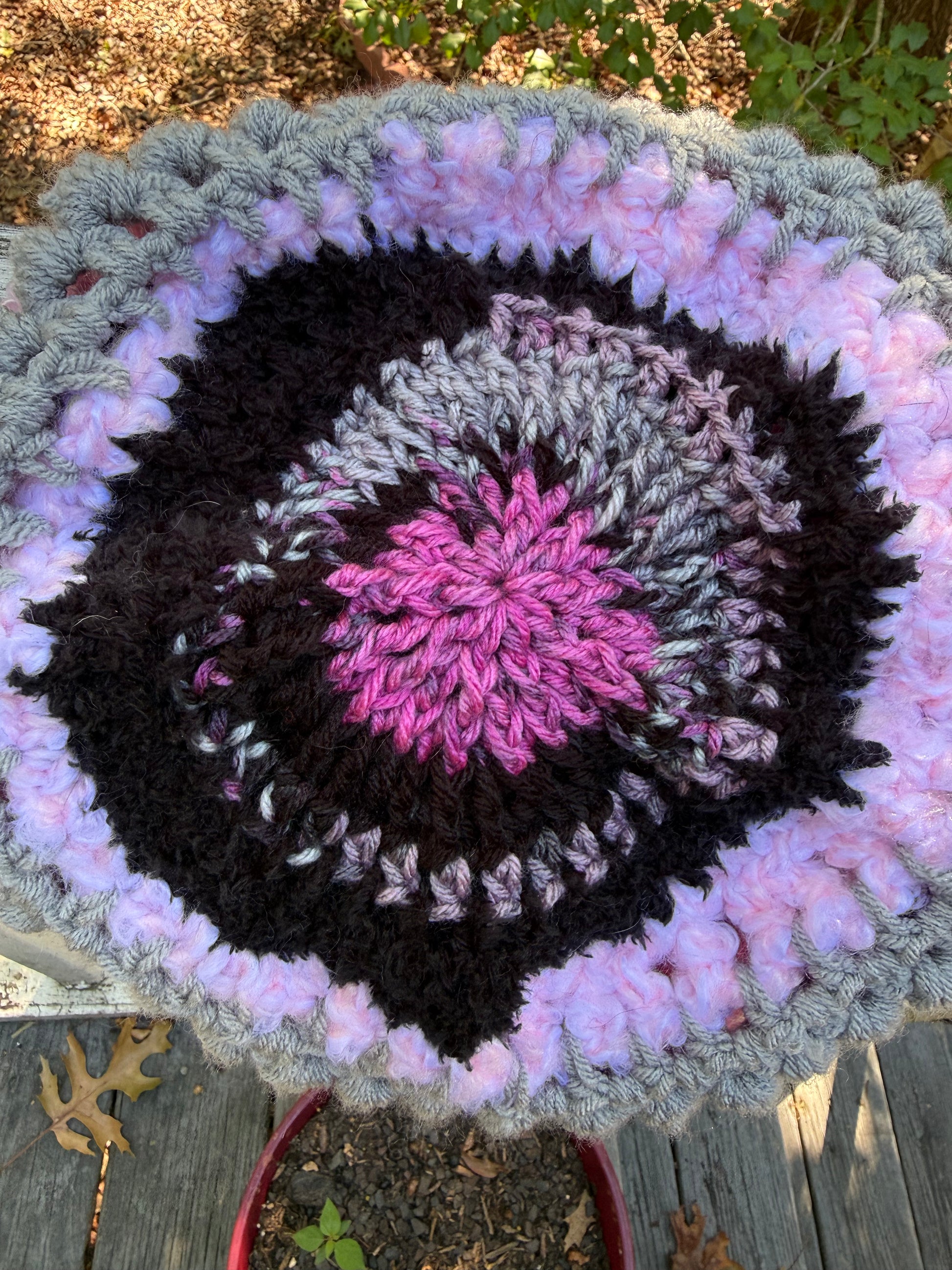 Top view of Love Spell No. 01 showing the circular ThermaCrown™ crochet construction in pink, grey and black
