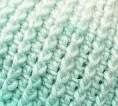 Close up of Mint Condition ribbed crochet beanie highlighting dense winter-ready stitch detail
