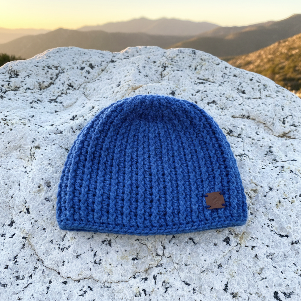 Open Sky ribbed Skull Hugger, Skull Cap crochet beanie styled flat lay highlighting structured cold-weather construction
