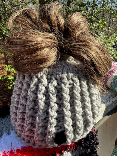 Silver Passage open tail messy bun classic rib crochet beanie styled for cold-weather wear. original photo