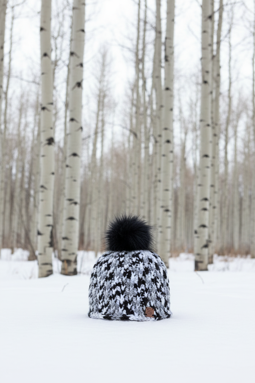 Snowdrift Ink ribbed crochet beanie worn outdoors in snowy aspen forest